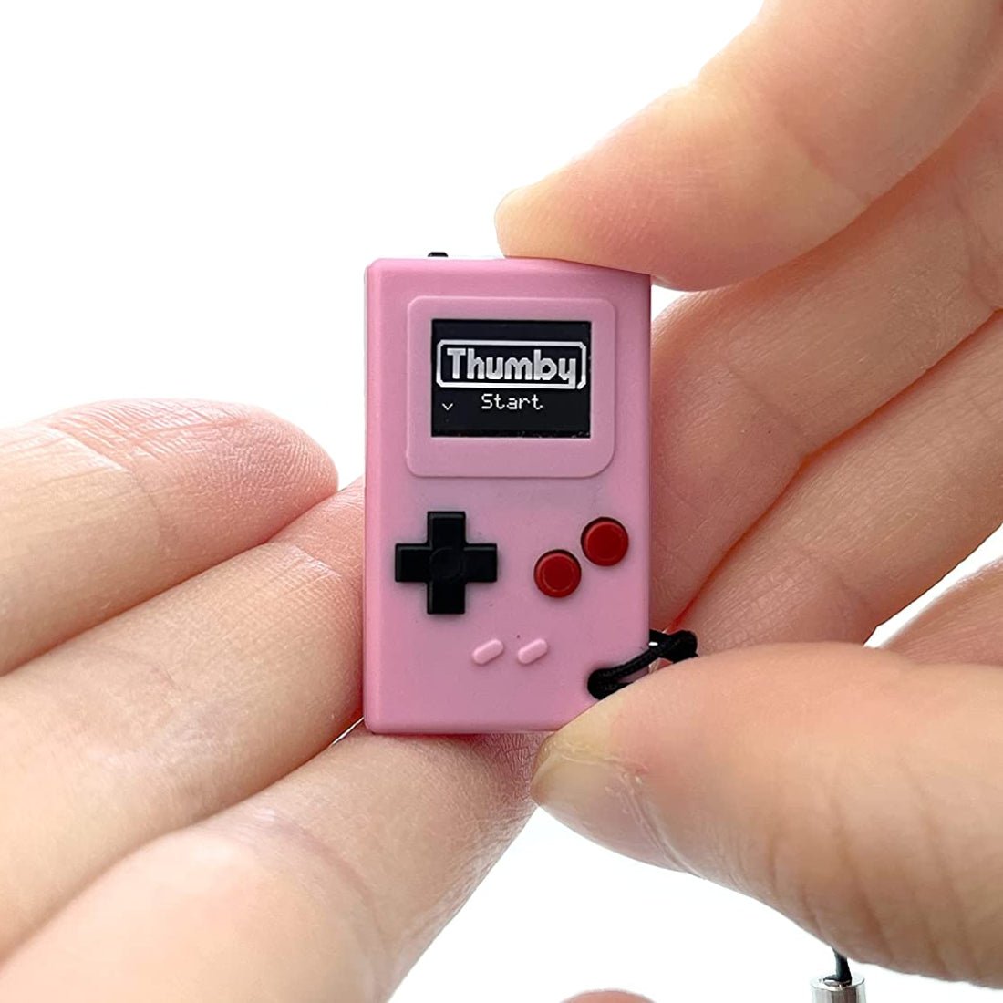 Tiny Circuits Thumby Playable Programmable Keychain Console - Pink - Store974 Electronics WLL | .. Tiny Circuits Thumby Playable Programmable Keychain Console - Pink - Store974 Electronics WLL | ..